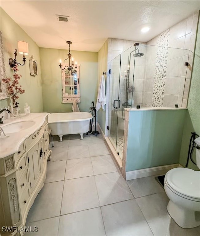 1700 E 15th St, Lehigh Acres, FL 33972 - bathroom featuring vanity, a soaking tub, a shower stall, a chandelier, and tile patterned floors