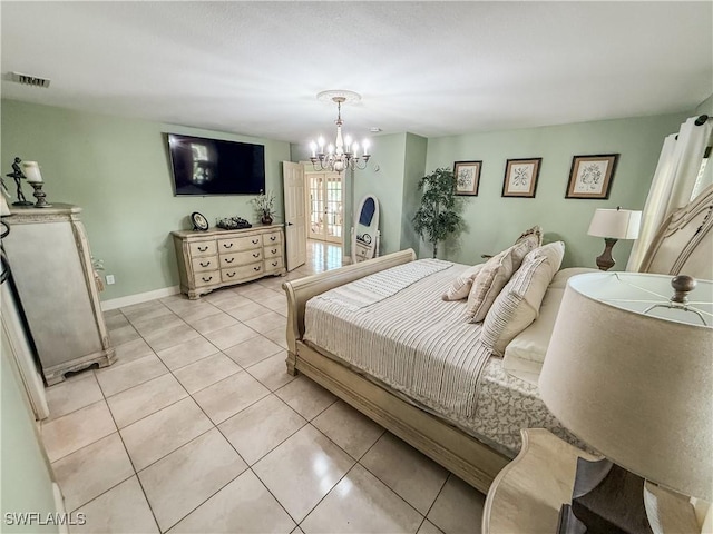 1700 E 15th St, Lehigh Acres, FL 33972 - bedroom with light tile patterned floors and a chandelier