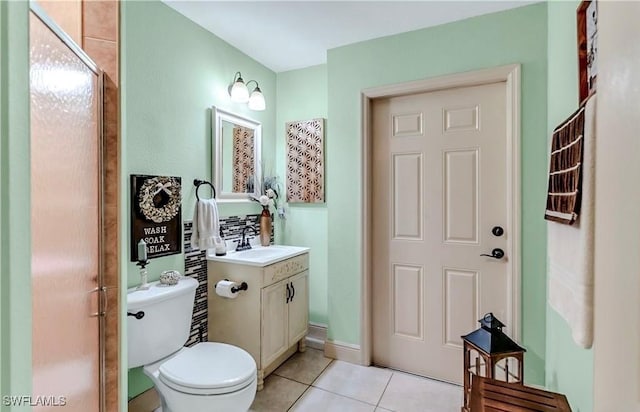1700 E 15th St, Lehigh Acres, FL 33972 - bathroom with tile patterned floors, vanity, and an enclosed shower