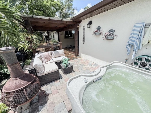 1700 E 15th St, Lehigh Acres, FL 33972 - view of patio / terrace featuring outdoor lounge area and an outdoor hot tub