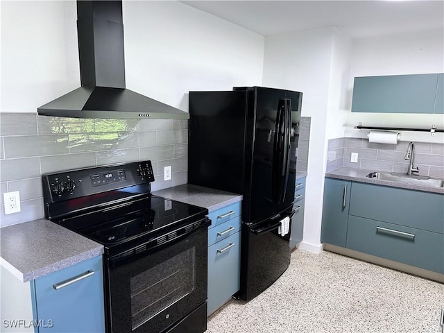 4360 Deleon St, Fort Myers, FL 33901 - kitchen with wall chimney range hood, black appliances, decorative backsplash, dark aggregate flooring, and blue cabinetry