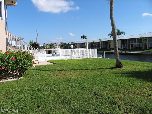834 SE 46th St Unit 2A, Cape Coral, FL 33904 - view of yard featuring a water view and stairs