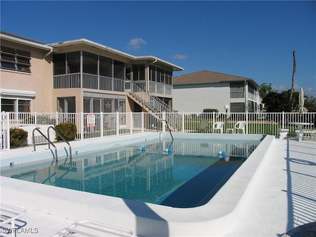 834 SE 46th St Unit 2A, Cape Coral, FL 33904 - community pool featuring a sunroom and stairway