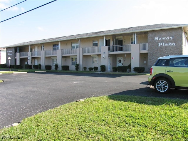 834 SE 46th St Unit 2A, Cape Coral, FL 33904 - view of building exterior with uncovered parking