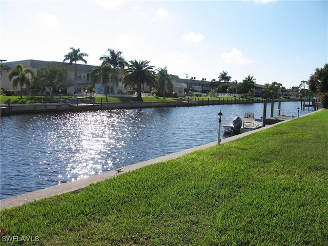 834 SE 46th St Unit 2A, Cape Coral, FL 33904 - dock area featuring a lawn and a water view
