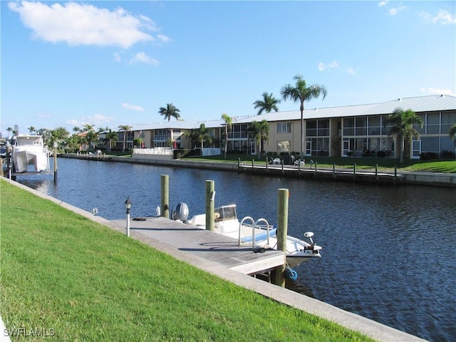 834 SE 46th St Unit 2A, Cape Coral, FL 33904 - dock area featuring a water view and a lawn