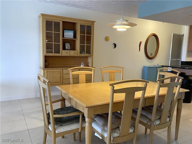 834 SE 46th St Unit 2A, Cape Coral, FL 33904 - dining space featuring light tile patterned floors and a textured ceiling