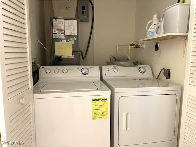 834 SE 46th St Unit 2A, Cape Coral, FL 33904 - washroom featuring washer and dryer and heating unit