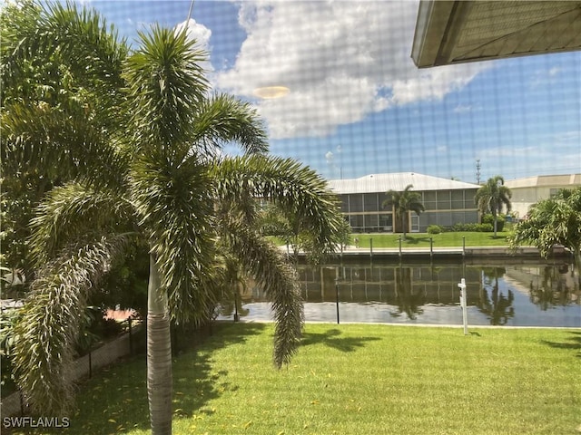 834 SE 46th St Unit 2A, Cape Coral, FL 33904 - view of grassy yard featuring a water view