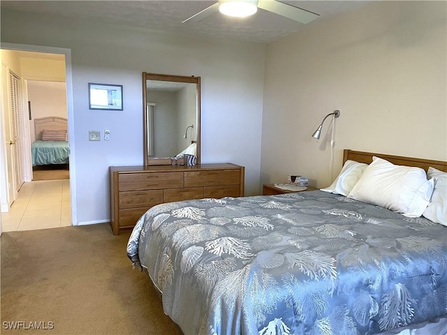 834 SE 46th St Unit 2A, Cape Coral, FL 33904 - bedroom featuring light colored carpet, ceiling fan, and light tile patterned flooring