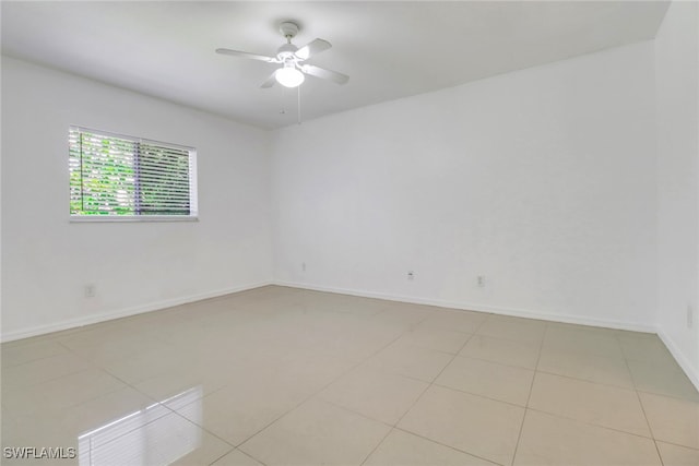 765 Aprile Ave S, Lehigh Acres, FL 33974 - unfurnished room with a ceiling fan and light tile patterned flooring