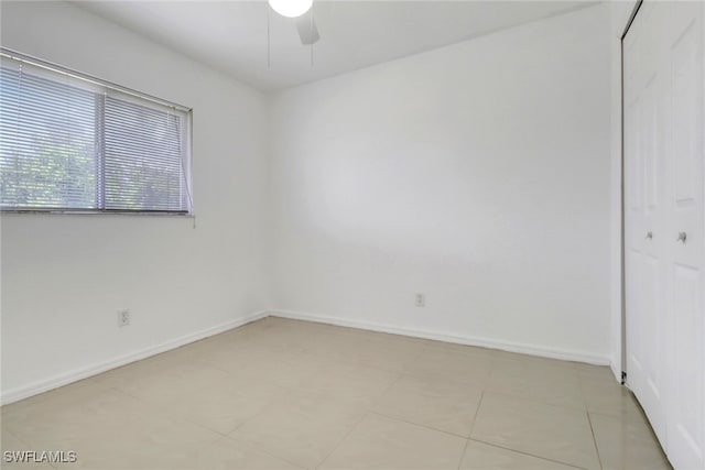 765 Aprile Ave S, Lehigh Acres, FL 33974 - empty room featuring ceiling fan and baseboards
