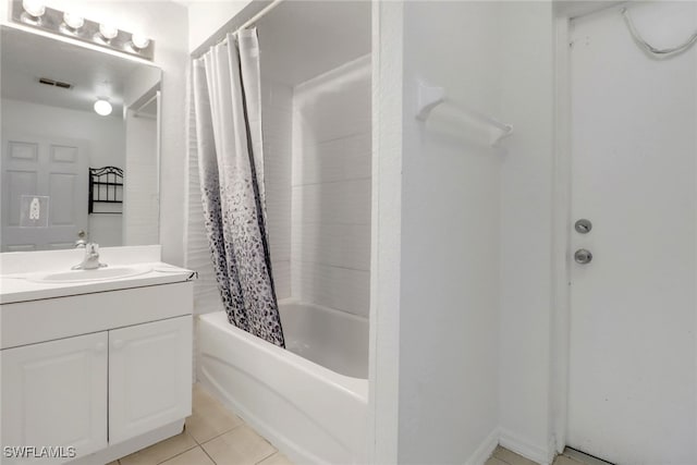 765 Aprile Ave S, Lehigh Acres, FL 33974 - bathroom featuring vanity, shower / bathtub combination with curtain, and tile patterned floors
