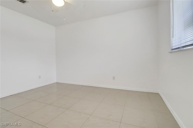 765 Aprile Ave S, Lehigh Acres, FL 33974 - unfurnished room featuring ceiling fan and light tile patterned floors