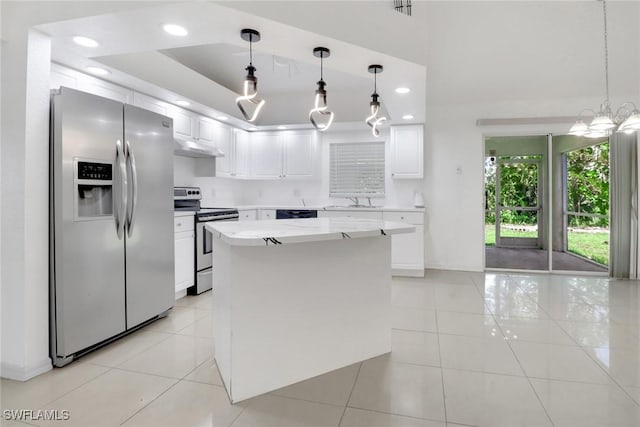 765 Aprile Ave S, Lehigh Acres, FL 33974 - kitchen featuring appliances with stainless steel finishes, light tile patterned flooring, white cabinets, under cabinet range hood, and recessed lighting