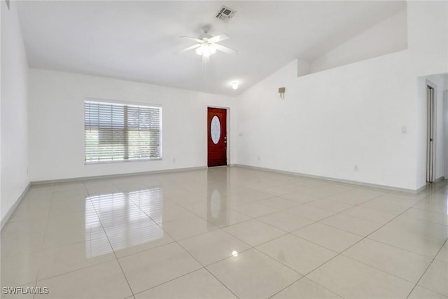 765 Aprile Ave S, Lehigh Acres, FL 33974 - empty room featuring vaulted ceiling, ceiling fan, and light tile patterned floors