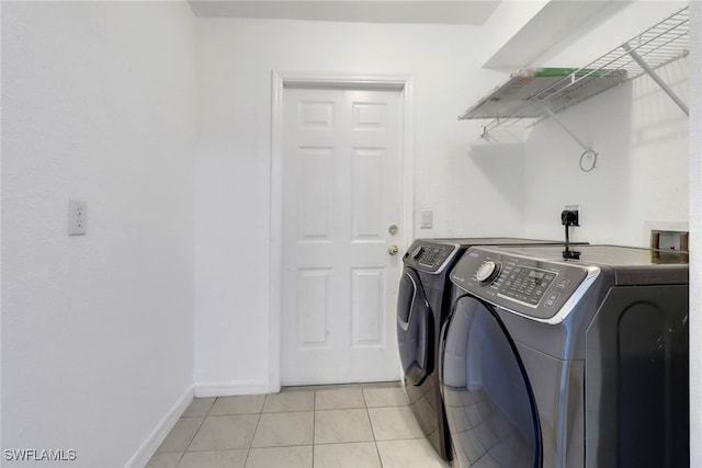 765 Aprile Ave S, Lehigh Acres, FL 33974 - laundry room featuring separate washer and dryer and light tile patterned floors