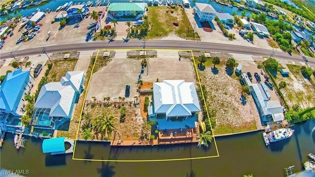 3226 Stringfellow Rd, Saint James City, FL 33956 - drone / aerial view of a large body of water