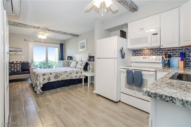 3226 Stringfellow Rd, Saint James City, FL 33956 - bedroom featuring freestanding refrigerator, light wood-style floors, and ceiling fan