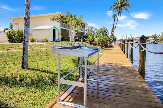 3226 Stringfellow Rd, Saint James City, FL 33956 - dock area with a lawn and a water view