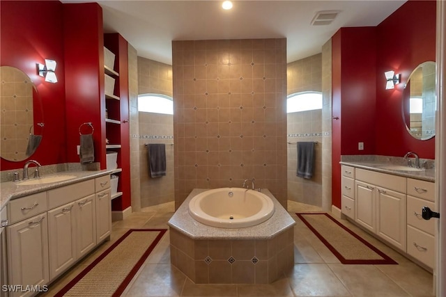 19801 N River Rd, Alva, FL 33920 - bathroom with tile patterned flooring, a garden tub, and two vanities