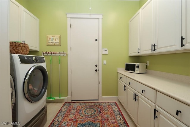 19801 N River Rd, Alva, FL 33920 - washroom featuring cabinet space and baseboards