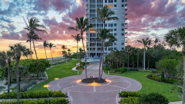 10 Seagate Dr Unit 10N, Naples, FL 34103 - view of community with curved driveway and a lawn