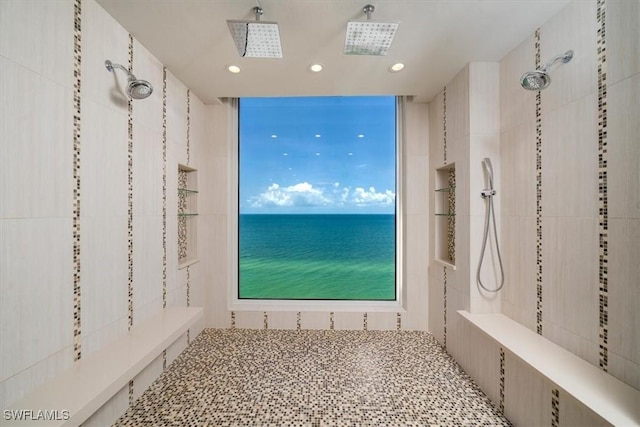10 Seagate Dr Unit 10N, Naples, FL 34103 - bathroom featuring tiled shower, recessed lighting, and a water view