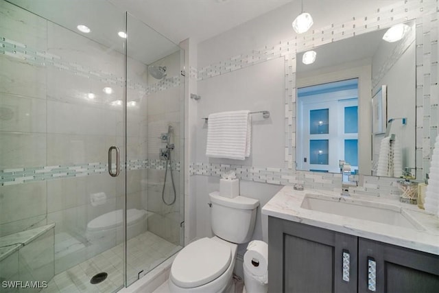 10 Seagate Dr Unit 10N, Naples, FL 34103 - full bath featuring vanity, a shower stall, and backsplash