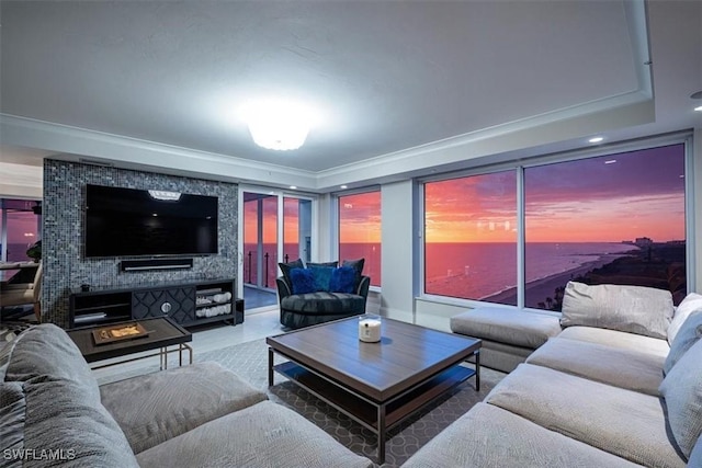 10 Seagate Dr Unit 10N, Naples, FL 34103 - living room featuring crown molding, a raised ceiling, and recessed lighting