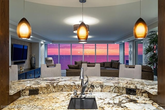 10 Seagate Dr Unit 10N, Naples, FL 34103 - kitchen with floor to ceiling windows and hanging light fixtures