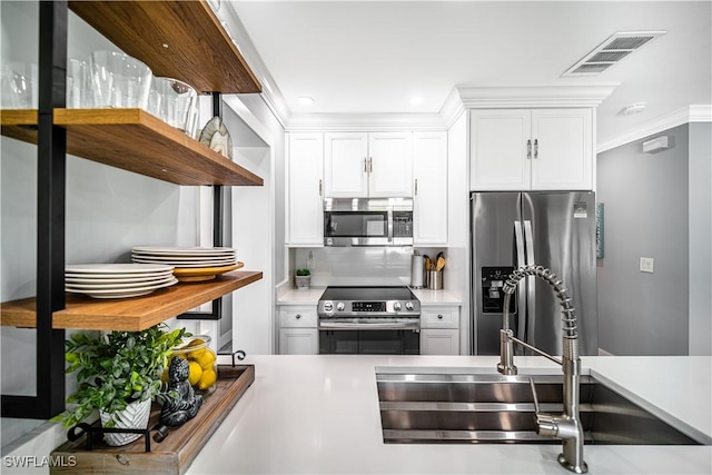 778 98th Ave N, Naples, FL 34108 - kitchen featuring appliances with stainless steel finishes, white cabinets, light countertops, recessed lighting, and open shelves