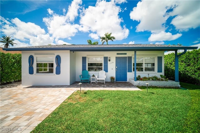 778 98th Ave N, Naples, FL 34108 - single story home featuring a porch, stucco siding, and a front lawn