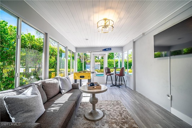 778 98th Ave N, Naples, FL 34108 - sunroom / solarium featuring plenty of natural light, wood finished floors, wooden ceiling, and an outdoor hangout area