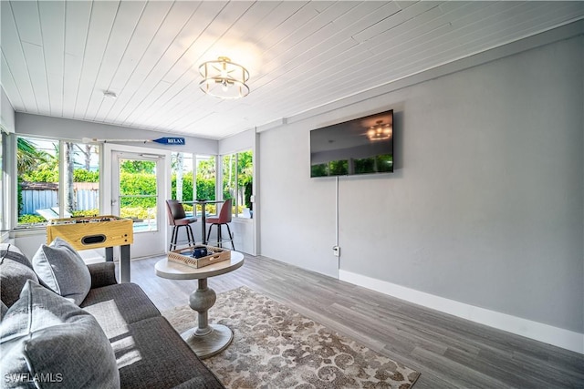 778 98th Ave N, Naples, FL 34108 - living area with healthy amount of natural light, wood ceiling, and wood finished floors