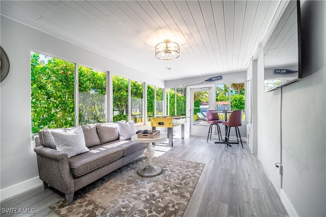 778 98th Ave N, Naples, FL 34108 - sunroom with outdoor lounge area, wood finished floors, a chandelier, and wooden ceiling