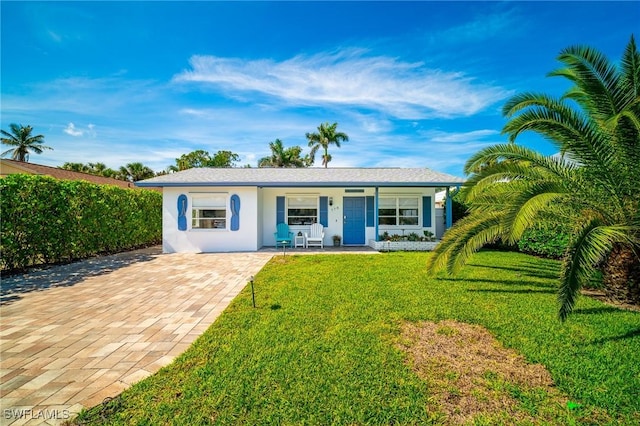 778 98th Ave N, Naples, FL 34108 - ranch-style house with a porch, a front lawn, stucco siding, and driveway