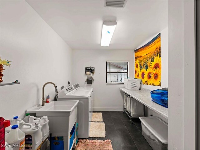 17577 Moorfield Dr, Fort Myers, FL 33908 - washroom with washing machine and dryer and baseboards