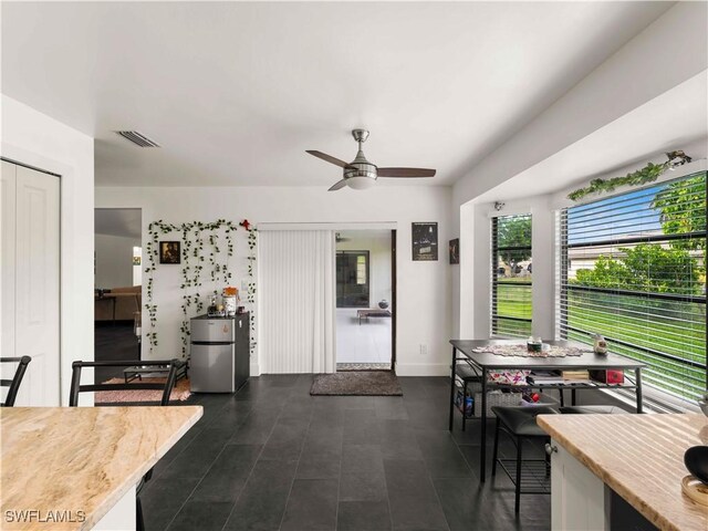17577 Moorfield Dr, Fort Myers, FL 33908 - dining space with ceiling fan and baseboards