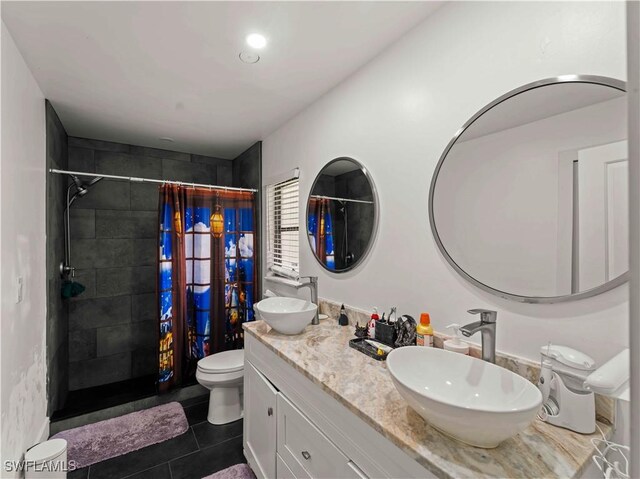 17577 Moorfield Dr, Fort Myers, FL 33908 - bathroom featuring tiled shower, double vanity, and tile patterned flooring