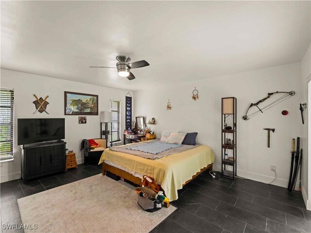 17577 Moorfield Dr, Fort Myers, FL 33908 - bedroom featuring dark tile patterned floors and ceiling fan