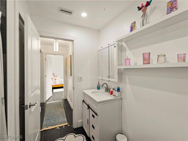 17577 Moorfield Dr, Fort Myers, FL 33908 - bathroom with vanity, recessed lighting, and tile patterned floors