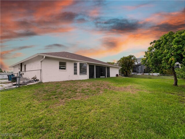 17577 Moorfield Dr, Fort Myers, FL 33908 - back of house at dusk featuring stucco siding