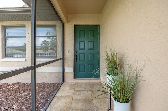 1831 SE 6th St, Cape Coral, FL 33990 - doorway to property with stucco siding