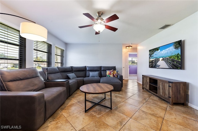 1831 SE 6th St, Cape Coral, FL 33990 - living room featuring plenty of natural light, a ceiling fan, and light tile patterned floors