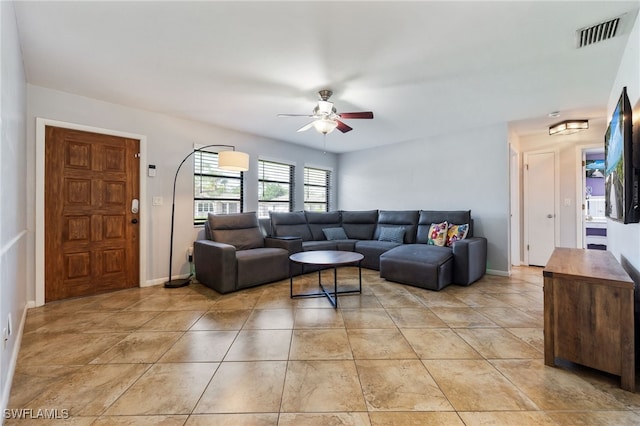 1831 SE 6th St, Cape Coral, FL 33990 - living room with a ceiling fan and light tile patterned flooring