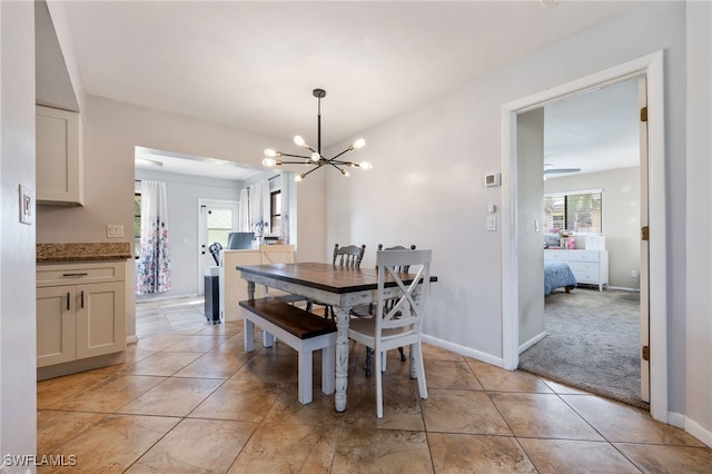 1831 SE 6th St, Cape Coral, FL 33990 - dining room with a chandelier and light tile patterned floors