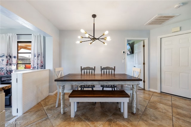 1831 SE 6th St, Cape Coral, FL 33990 - dining room with a chandelier and baseboards