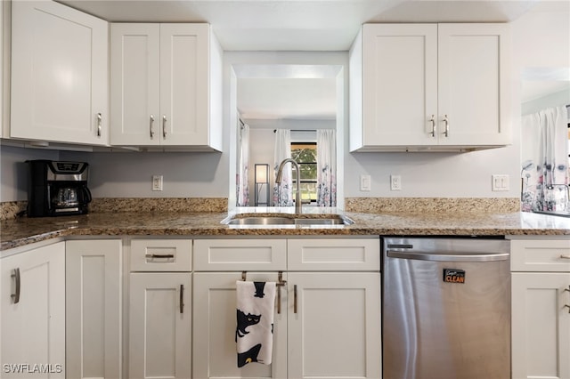 1831 SE 6th St, Cape Coral, FL 33990 - kitchen with stainless steel dishwasher, white cabinetry, and light stone counters