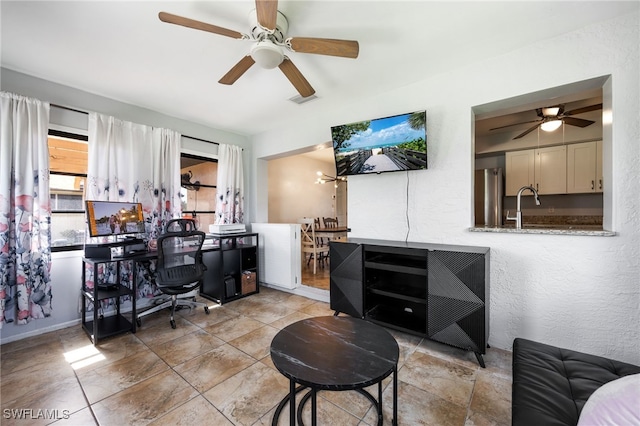 1831 SE 6th St, Cape Coral, FL 33990 - office space with a ceiling fan, light tile patterned floors, and a textured wall